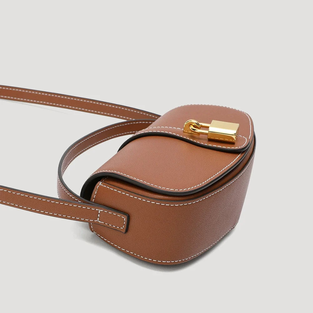 Tan Leather Mini Saddle Bag with Gold Padlock Clasp and Contrast Stitching